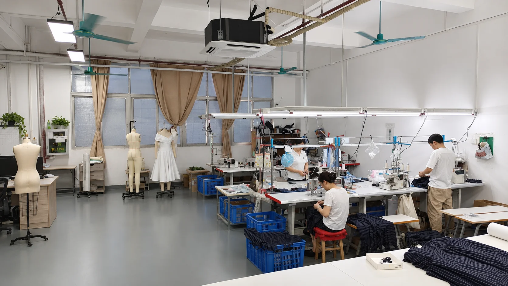 YIDI company sample room with dress forms and garment development workstations.