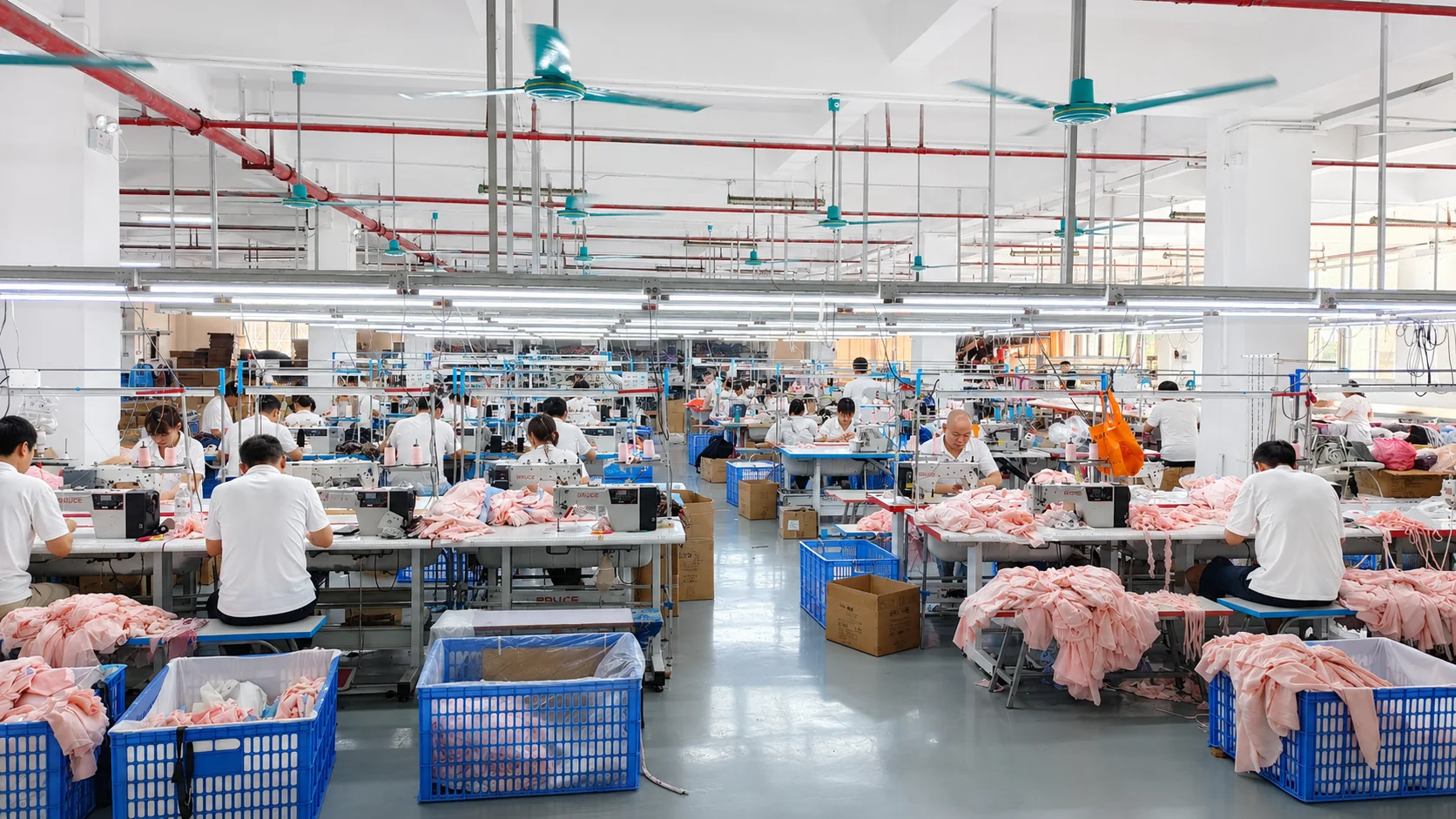 Garment sewing workstations in the YIDI company workshop.