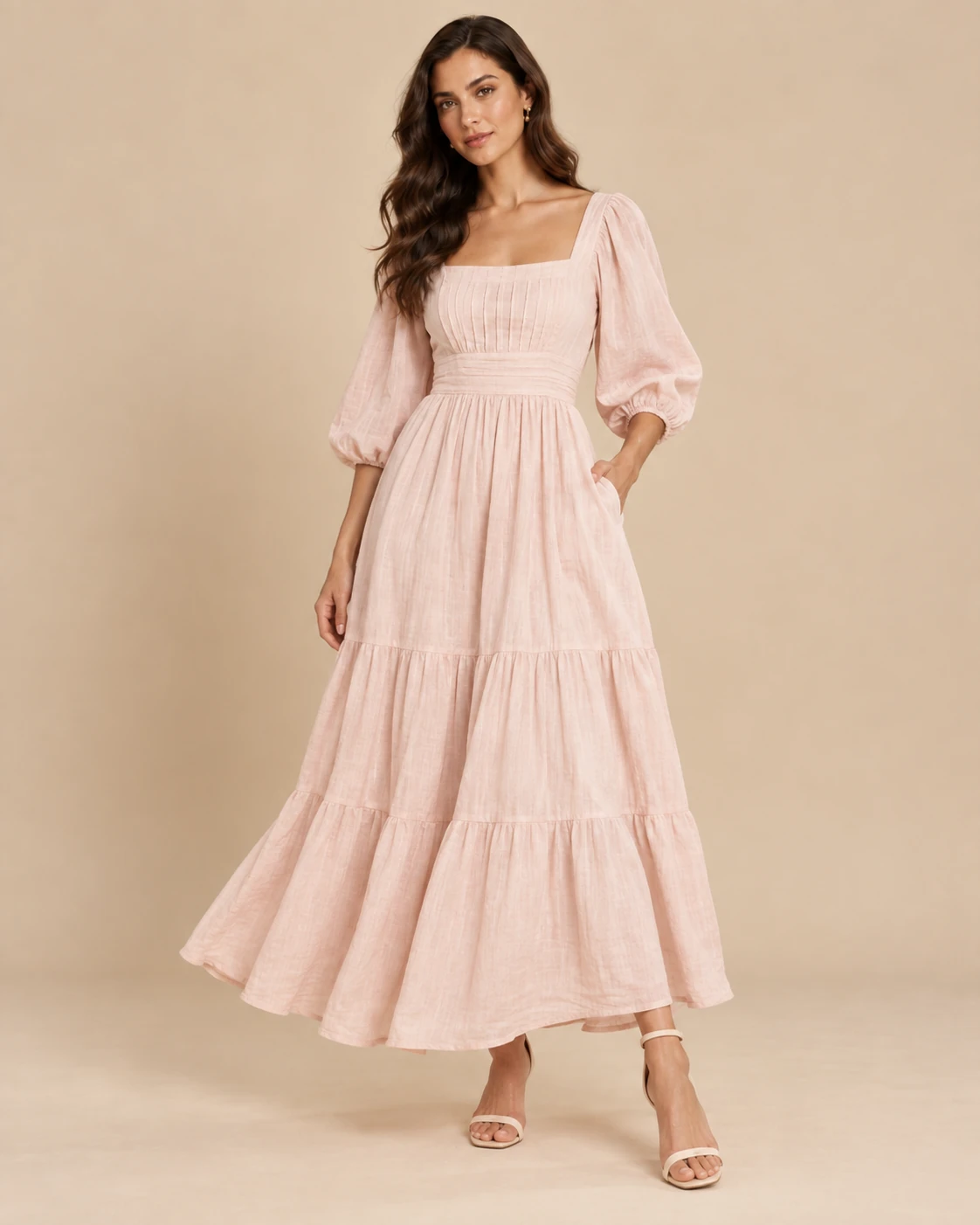 Blush dress concept with a square neckline, puff sleeves and a tiered skirt.